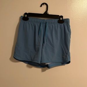 Blue Nike athletic shorts